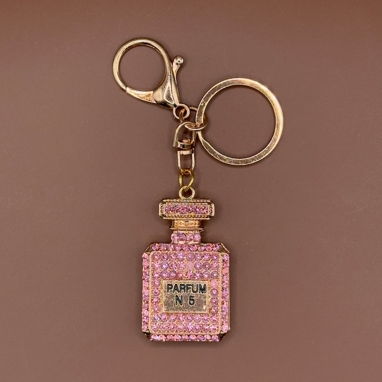 Rhinestone perfume bottle keychain in rose gold
