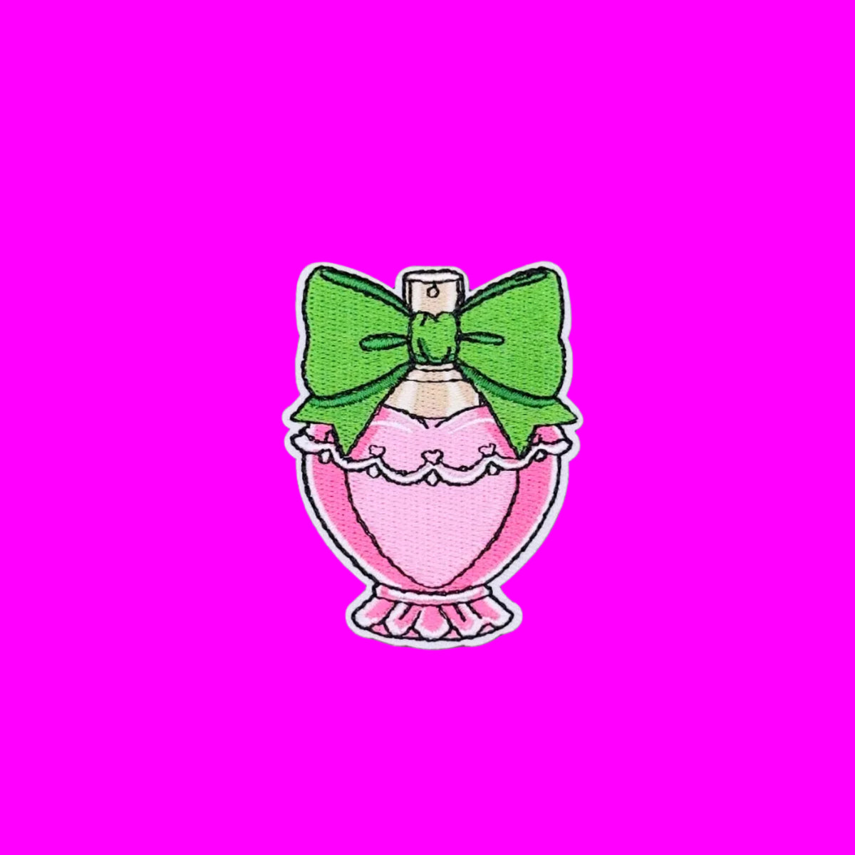 Glamorous pink perfume bottle with large green bow embroidered iron on patch.