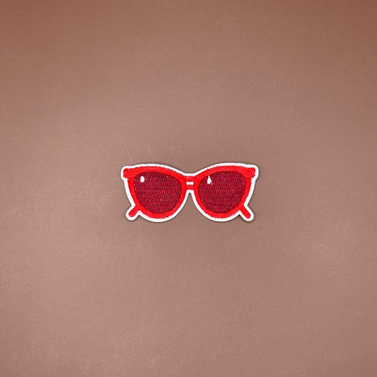 Bright red cat-eye sunglasses iron-on patch with tinted lenses