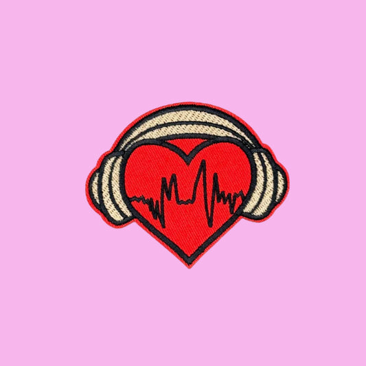 Red beating heart beat with gold headphones embroidered iron on patch.
