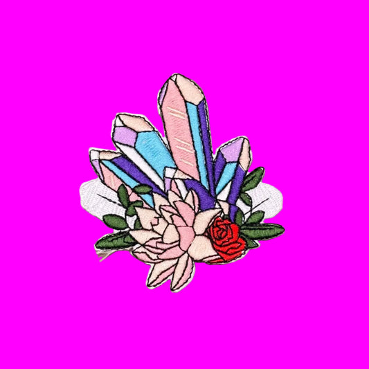 Embroidered iron-on patch of pink, lilac and blue quartz points set into blush flowers