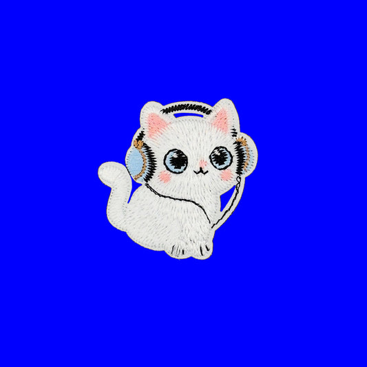 A white embroidered cat patch wearing light blue and gold headphones, centered on a solid brown background.