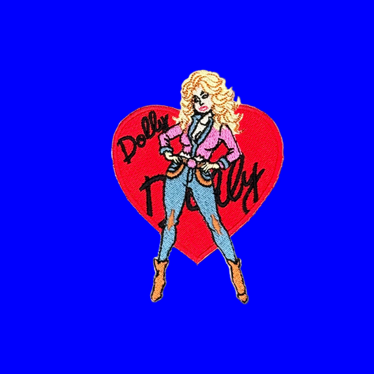 Dolly Parton heart iron-on patch with pink jacket and cowboy boots over a red heart