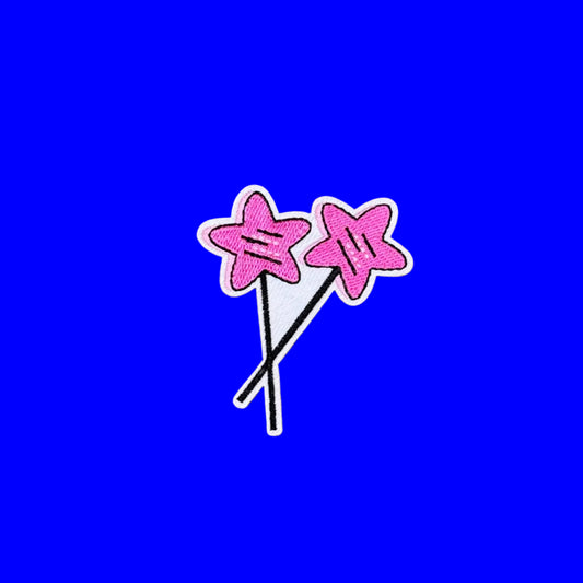 Iron-on patch of two pink star magic wands crossed at the sticks