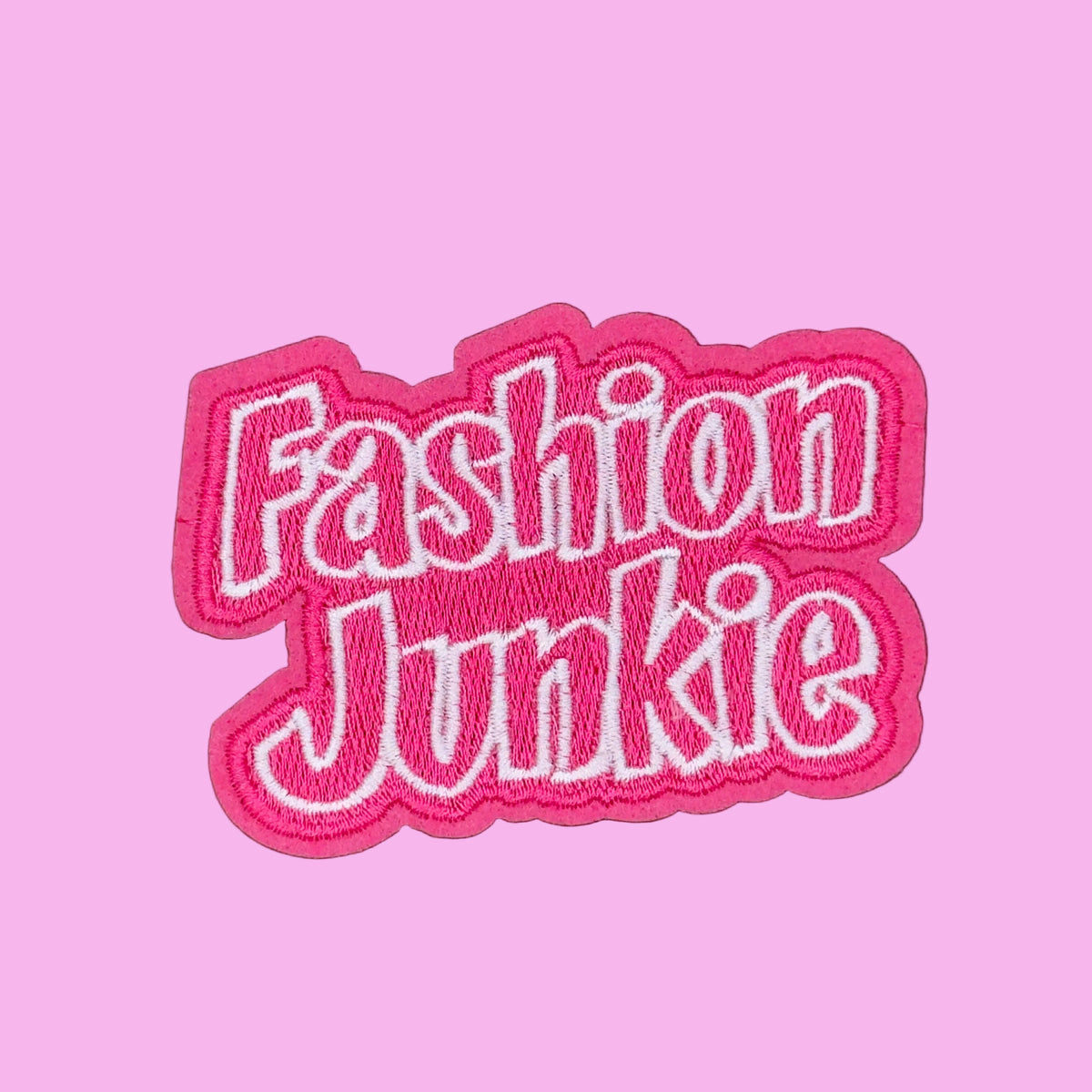 Fashion Junkie written in bubble letters in pink with a white border. Embroidered patch.