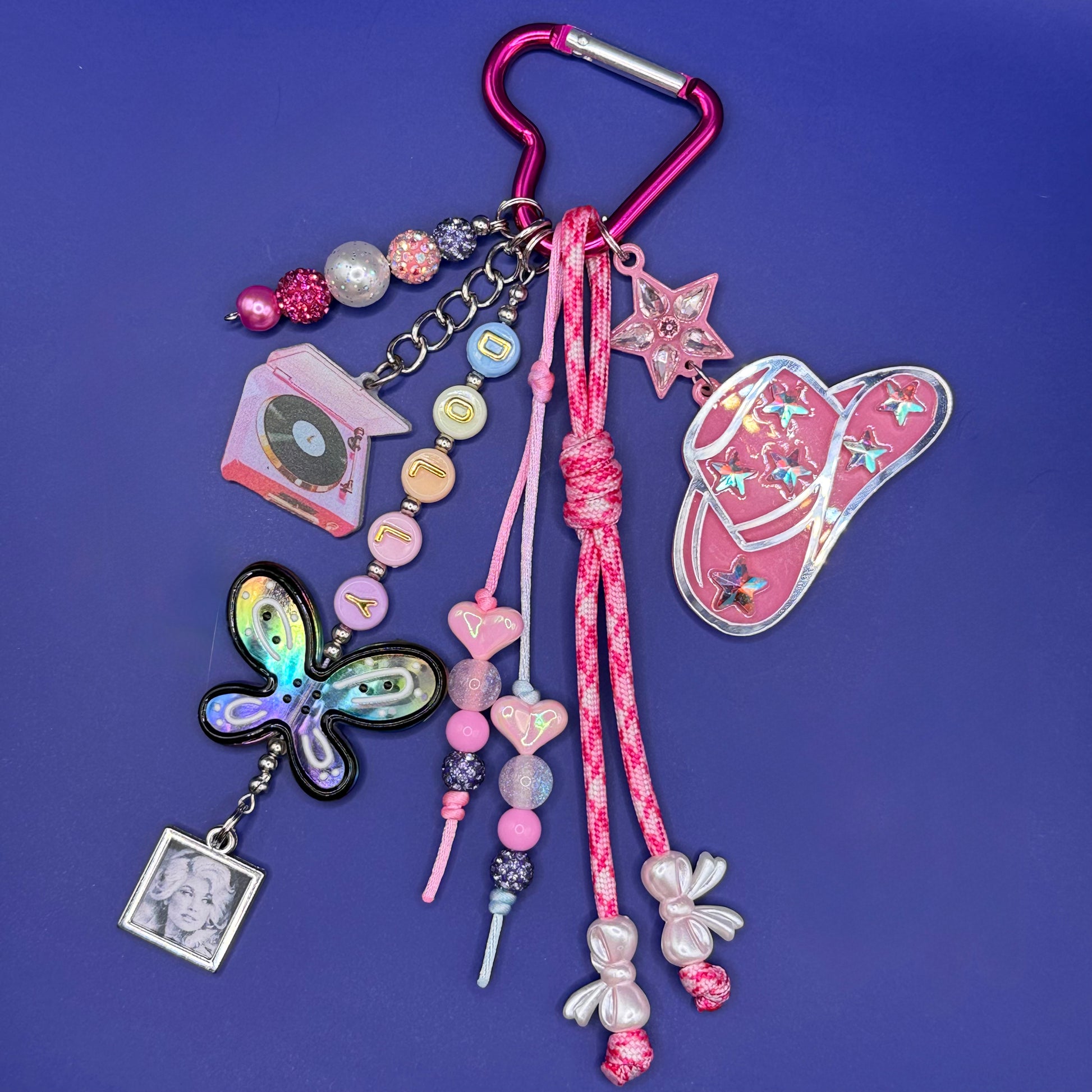 Dolly Parton bag charm with holographic butterfly, cowgirl hat and DOLLY letter beads