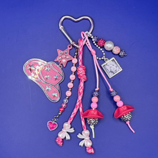 Dolly Parton portrait bag charm with starry pink cowboy hat on silver heart carabiner