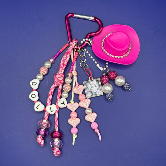 Hot pink Dolly Parton bag charm with heart carabiner, pink cowboy hat and DOLLY beads