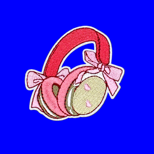 Pink over the hear headphones with light pink bows on the side and small hearts.