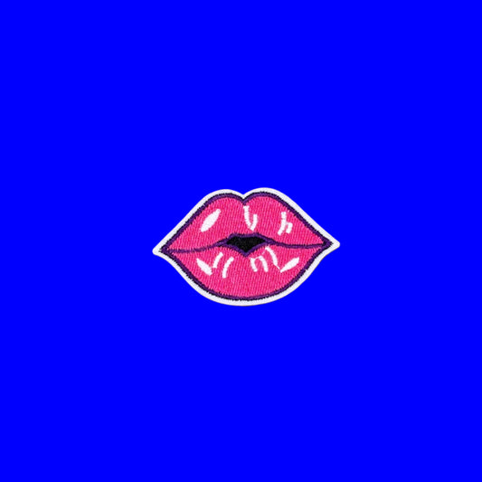 Hot pink lips iron-on patch outlined in deep plum with a glossy highlight