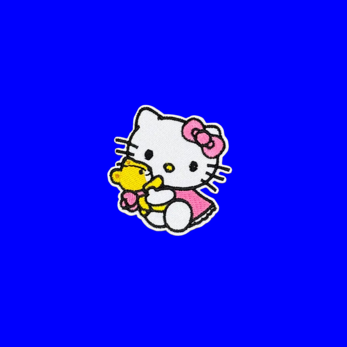 Hello Kitty  in pink dress and pink bow with yellow teddy bear embroidered patch