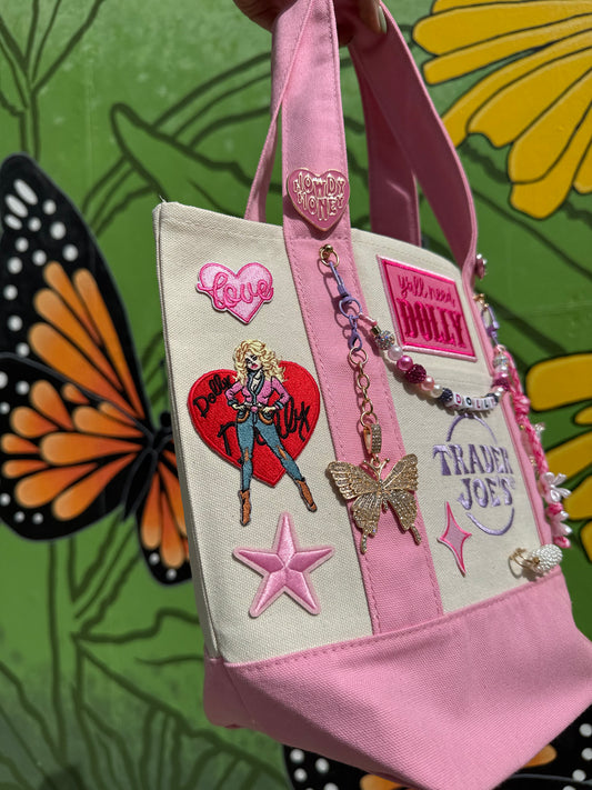 Pink and cream tote with Dolly Parton heart patch, butterfly and star patches