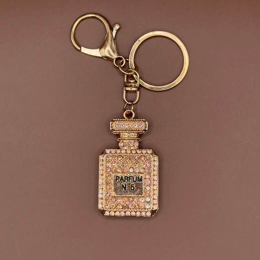 Rhinestone perfume bottle keychain in gold
