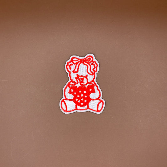 Teddy bear with strawberry embroidered patch