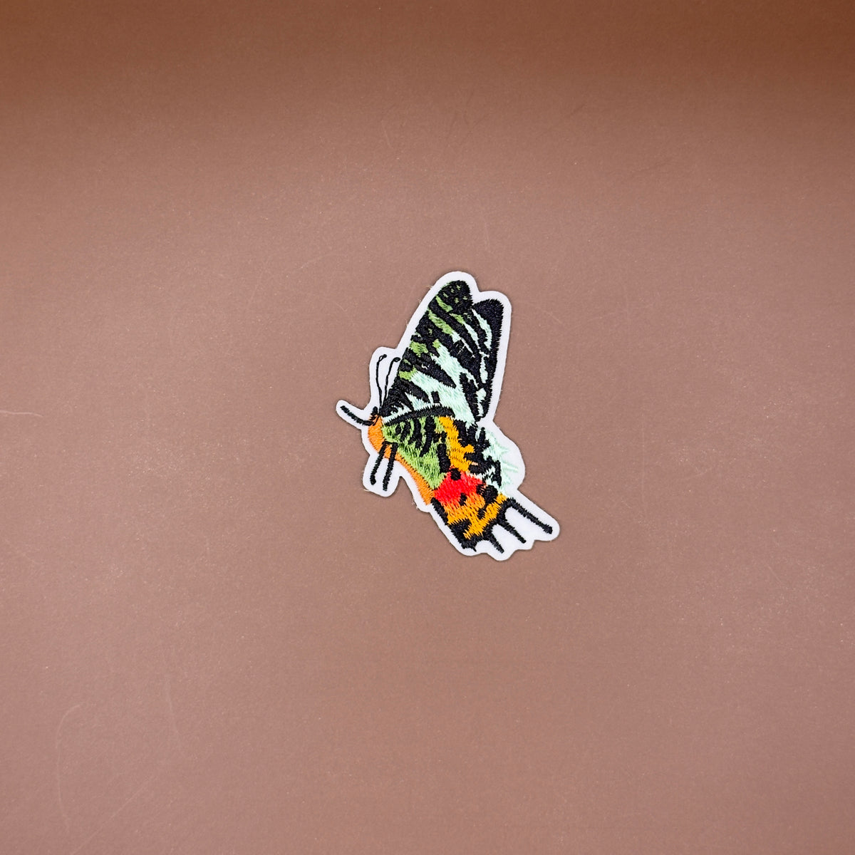 Green butterfly profile embroidered patch