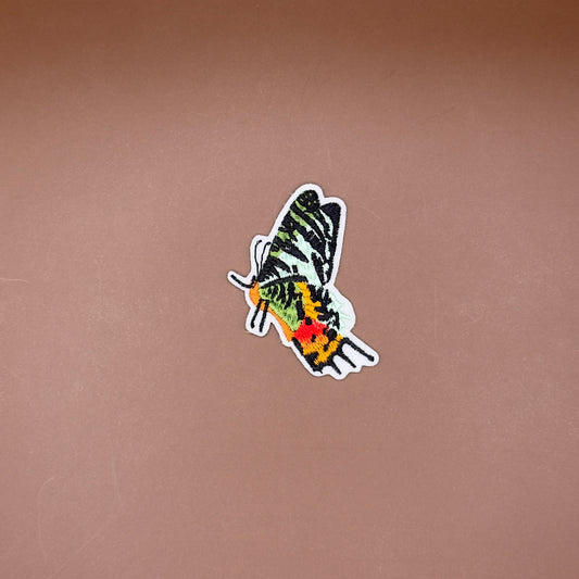 Green butterfly profile embroidered patch