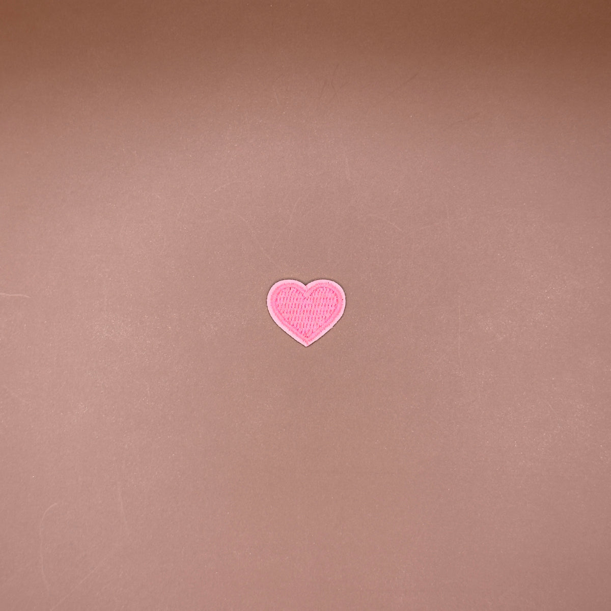 Pink heart embroidered iron-on patch, small size