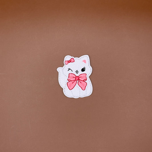 Winking coquette kitten with bow embroidered patch