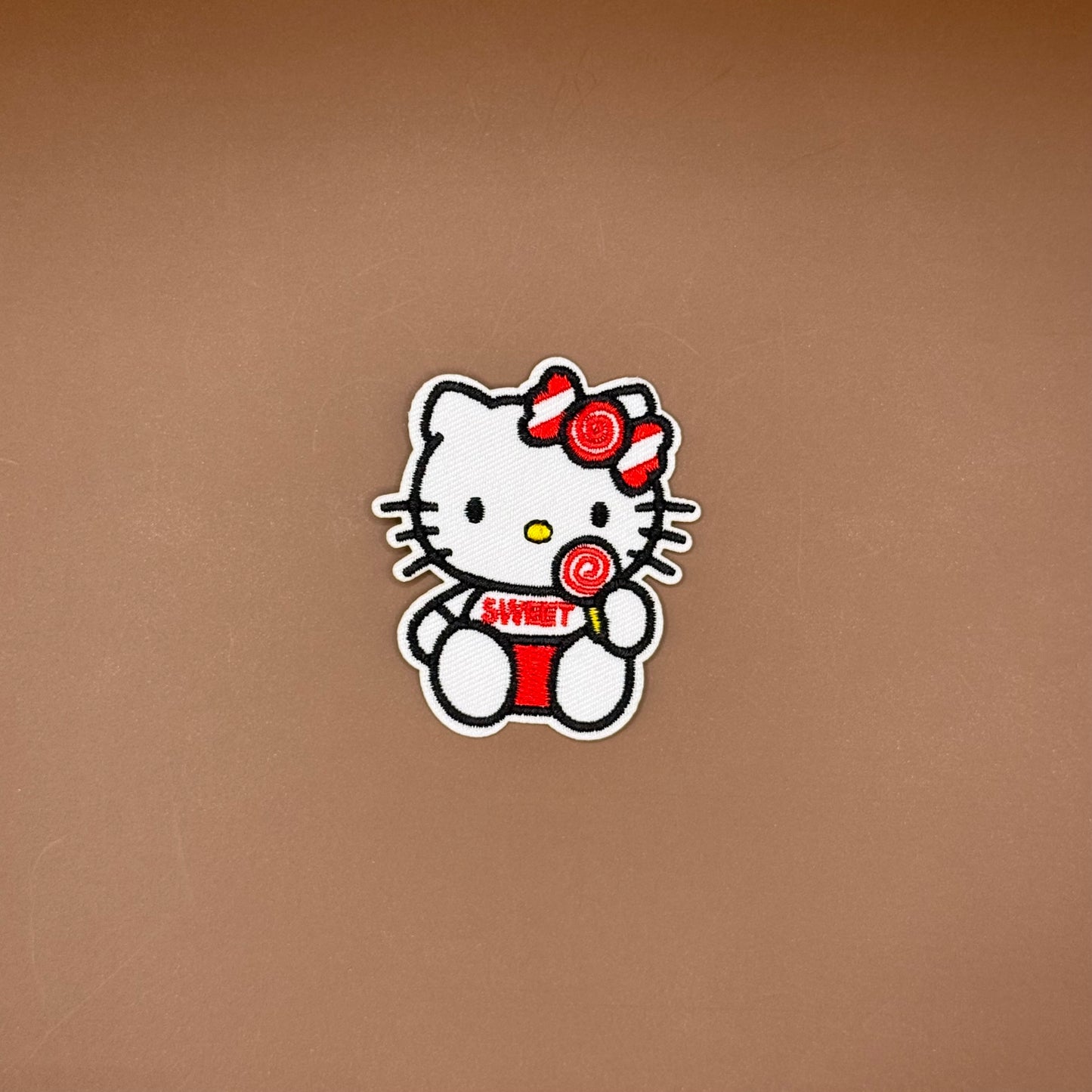 Hello Kitty with lollipop embroidered patch