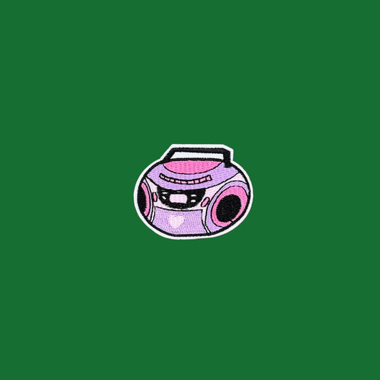 Lilac and pink boombox iron-on patch with the handle up and speakers showing