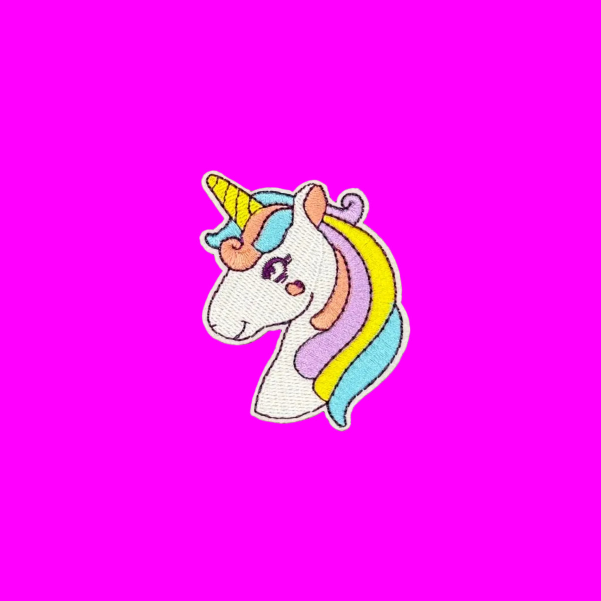 Pastel rainbow colored main on a white unicorn head with a yellow gold horn embroidered patch.