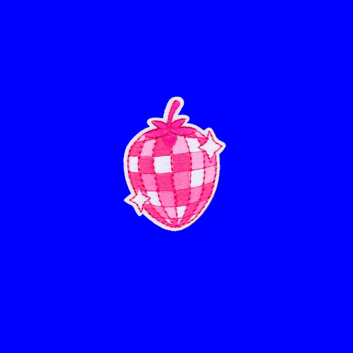 A pink and white checkered strawberry patch with small white stars.