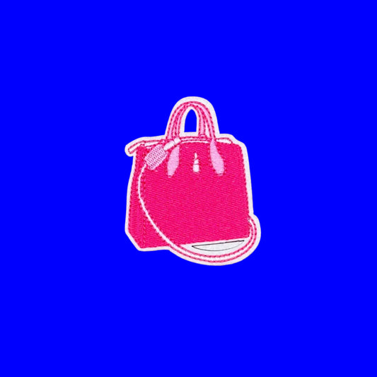 Hot pink top-handle handbag iron-on patch with a long crossbody strap