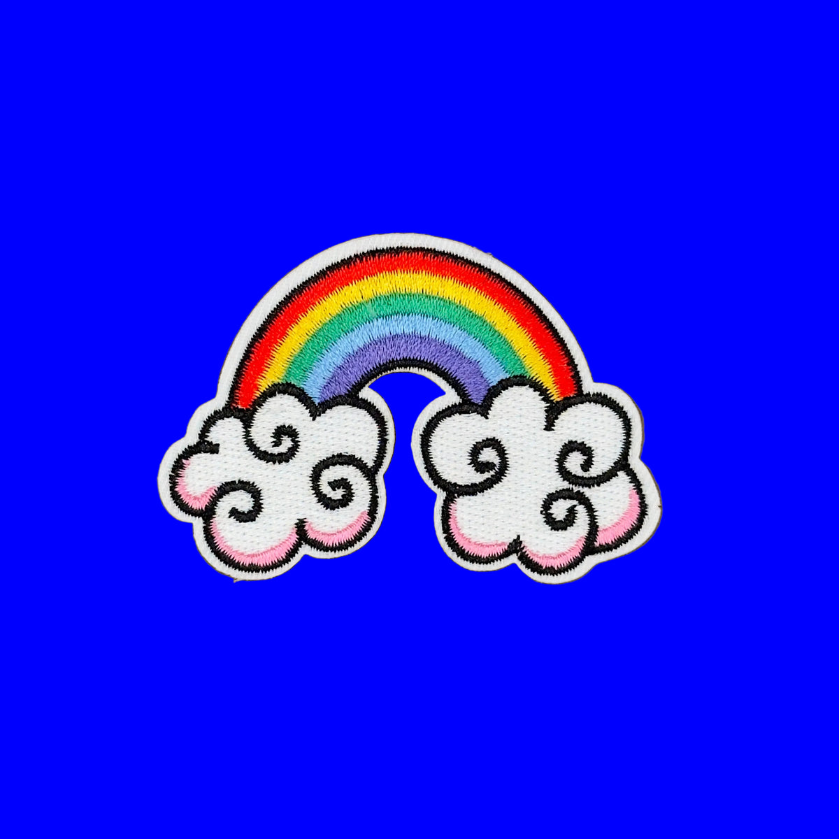 Colorful rainbow in clouds embroidered patch.