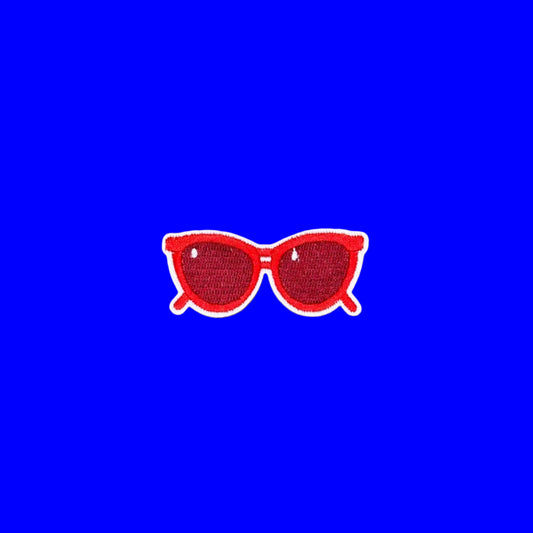 Bright red cat-eye sunglasses iron-on patch with tinted lenses