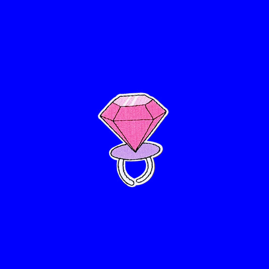 Iron-on patch of an oversized pink candy gem ring on a lilac band