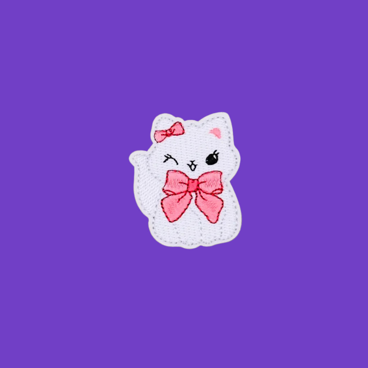 Winking coquette kitten with bow embroidered patch